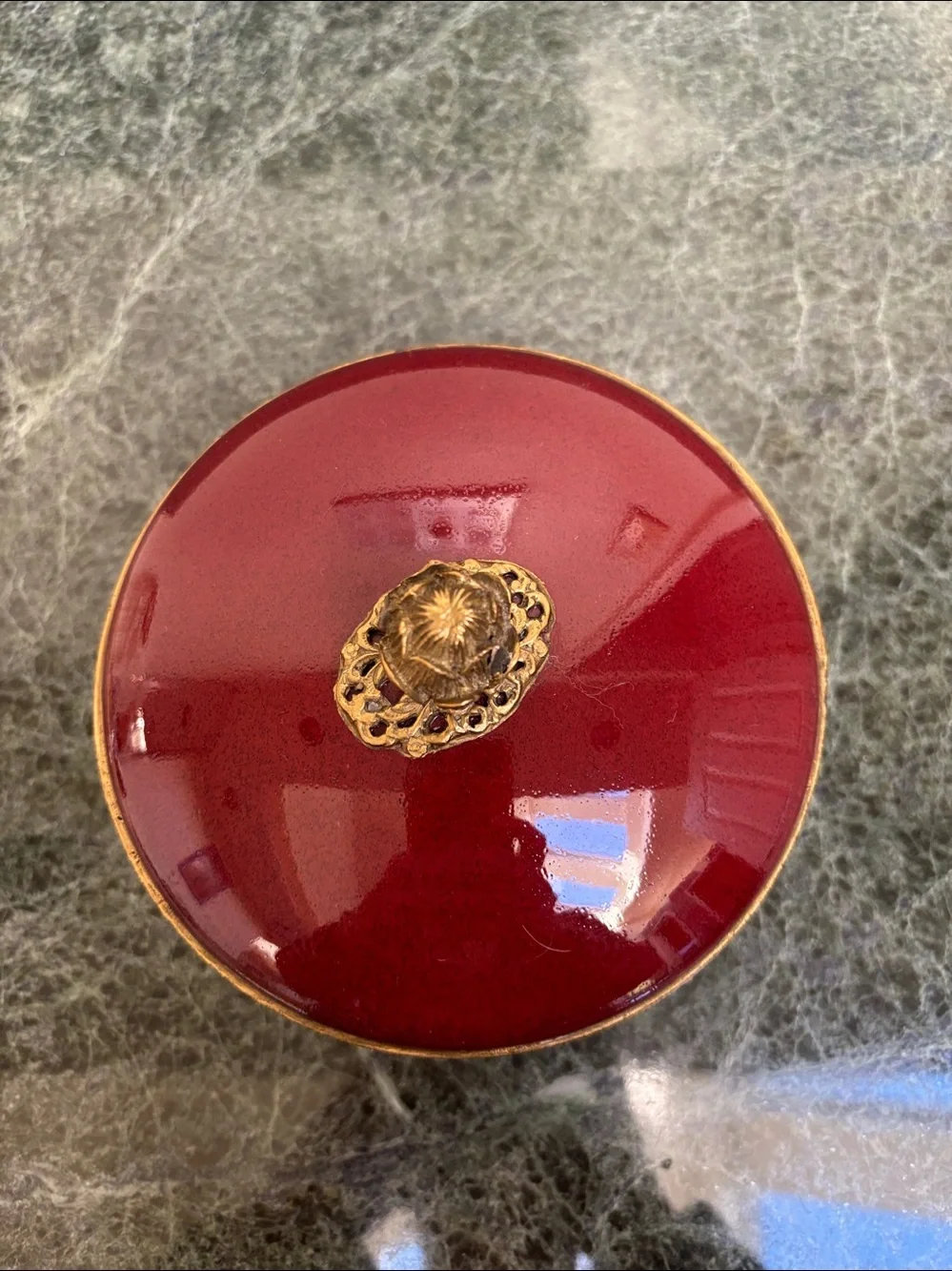vintage porcelain trinket box with an ornate brass rim
